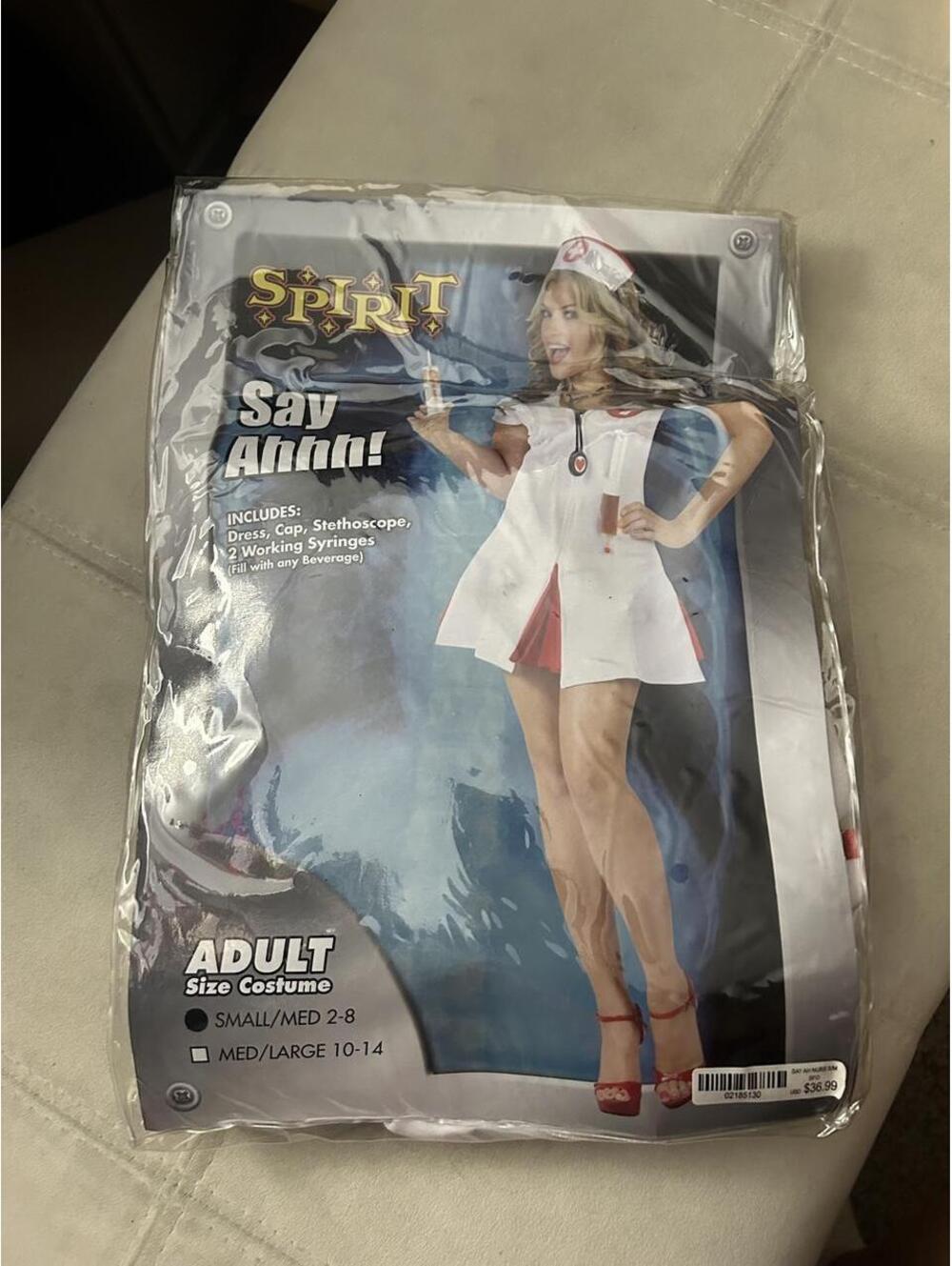 Spirit Halloween Nurse costume in white & red, size M/L 10-14 New in the package